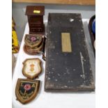 An apprentice style small chest; a selection of cloth badges in frames; a japanned tin