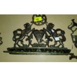 A late 19th/early 20th century Hanukkah light -Menorah with twin lions rampant and heart with Hebrew