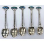 A set of 5 hallmarked silver teaspoons by Liberty & Co with trefoil terminals decorated with