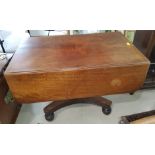 A Victorian mahogany supper table with drop ends and single drawer on column pedestal.