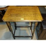A 1930's oak occasional table with canted rectangular top, on barley twist legs
