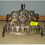 A silvered metal Hanukkah light -Menorah with twin lions rampant width 21cm