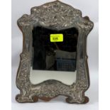A hallmarked silver large dressing table mirror of easel form with embossed decoration, Birmingham