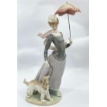 A LLADRO porcelain figure of a lady with parasol walking her dog, 43cm
