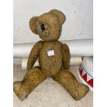 An early 20th century teddy bear and a selection of 20th century surgery certificates
