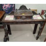 A Victorian Gothic carved oak hall table with single drawer to the top, with inset tiles, on