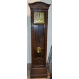 An early 20th century oak long case clock in Arts & Crafts carved case with striking movement