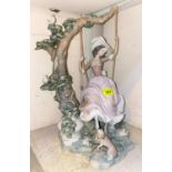 A large Lladro figure: girl on a swing