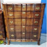 A reproduction continental style stained wood five height chest of drawers on ball and claw feet,