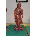 Chinese carved wooden figure of a sage with bead eyes to face and shoulder, height 30cm