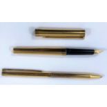 A vintage S.T. Dupont silver gilt fountain pen and ball point with 18ct gold nib red and blue