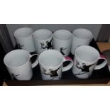 Seven Banksy mugs, various designs