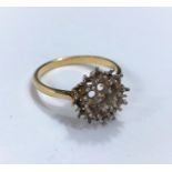 A yellow metal cluster ring st. 18ct, stones missing, 4gm