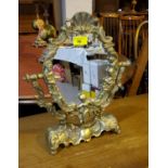 A brass classical style swing dressing table mirror decorated with cherubs etc, height 38cm