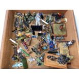 A selection of metal and plastic painted and unpainted military table top miniatures of various si