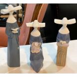 LLADRO - Three porcelain figures of nuns 27cm & 22cm