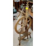 A 19th century spinning wheel with treadle action