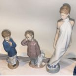 3 Nao figures: Young woman in long dress & two young boys with teddy bear.