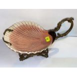 A pottery scallop shell bowl by Sarreguimes in ornate brass stand, length 36 cm