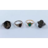 A yellow metal ring set green cabochon stone, unmarked, tests as circa 18 carat, 2 gm; 3 other rings