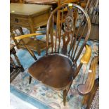 An Ercol hoop and stick back armchair and a set of 4 similar dining chairs