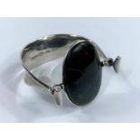 Georg Jensen: a silver bracelet/bangle designed by Vivianna Torun Bülow-Hübe, set oval polished