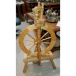 A reproduction spinning wheel with treadle action