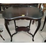 An Edwardian kidney shaped occasional table, with 2 tiers in dark wood