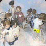 Seven Nao porcelain figures of children