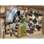 A selection of metal and plastic painted and unpainted military table top miniatures of various
