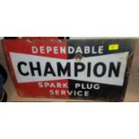 An enamel advertising sign for Champion spark plugs, 33 x 58 cm