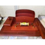 An early / mid 20th century red leather desk set including blotter, letter rack, pen stand,