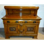 An Edwardian golden oak buffet sideboard with raised back and carved decoration, 2 cupboards and 2