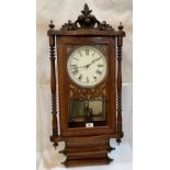 A walnut inlaid American wall clock 35' high