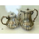 A Victorian silver teapot and coffee pot of foliate chased baluster form. London 1880 and 1881.