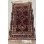 A small eastern rug. 57' x 32'