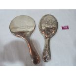 Two silver hand mirrors