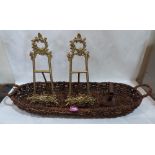 A pair of rococo revival brass stands with strut backs, a basket and a flat iron