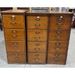 Three 1920s oak four drawer filing cabinets. 53' high