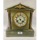 A French onyx architectural case mantle clock 11' high together with an onyx clock case