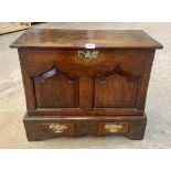 A small joined oak dower chest, the front with two fielded panels over a pair of drawers, raised