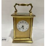 A French brass carriage timepiece with platform lever escapement. 4¼' high. Chips to side glass,