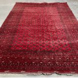 A red ground hand knotted eastern carpet 156' x 118'