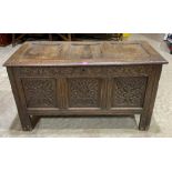 A late 17th century joined oak carved three panel chest, raised on stiles. 48' wide