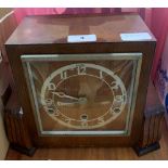 An oak three train mantle clock