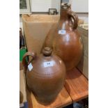 Two stoneware ovoid jars, the larger with extensive cracks, 19' high, the other 11½' high
