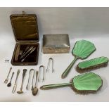 A silver cigarette box; a silver and guilloche enamel dressing table set (A.F.); three silver