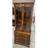 A mahogany bookcase of recent manufacture, enclosed by a pair of astragal glazed doors over a