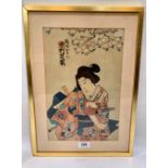 JAPANESE SCHOOL. MEIJI 1868-1912 An onnabugeisha. Coloured woodblock 13½' x 8¾'