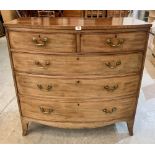 A George III mahogany bowfronted chest of two short over three long drawers raised on splayed
